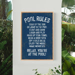 a pool rules sign hanging on the side of a wall