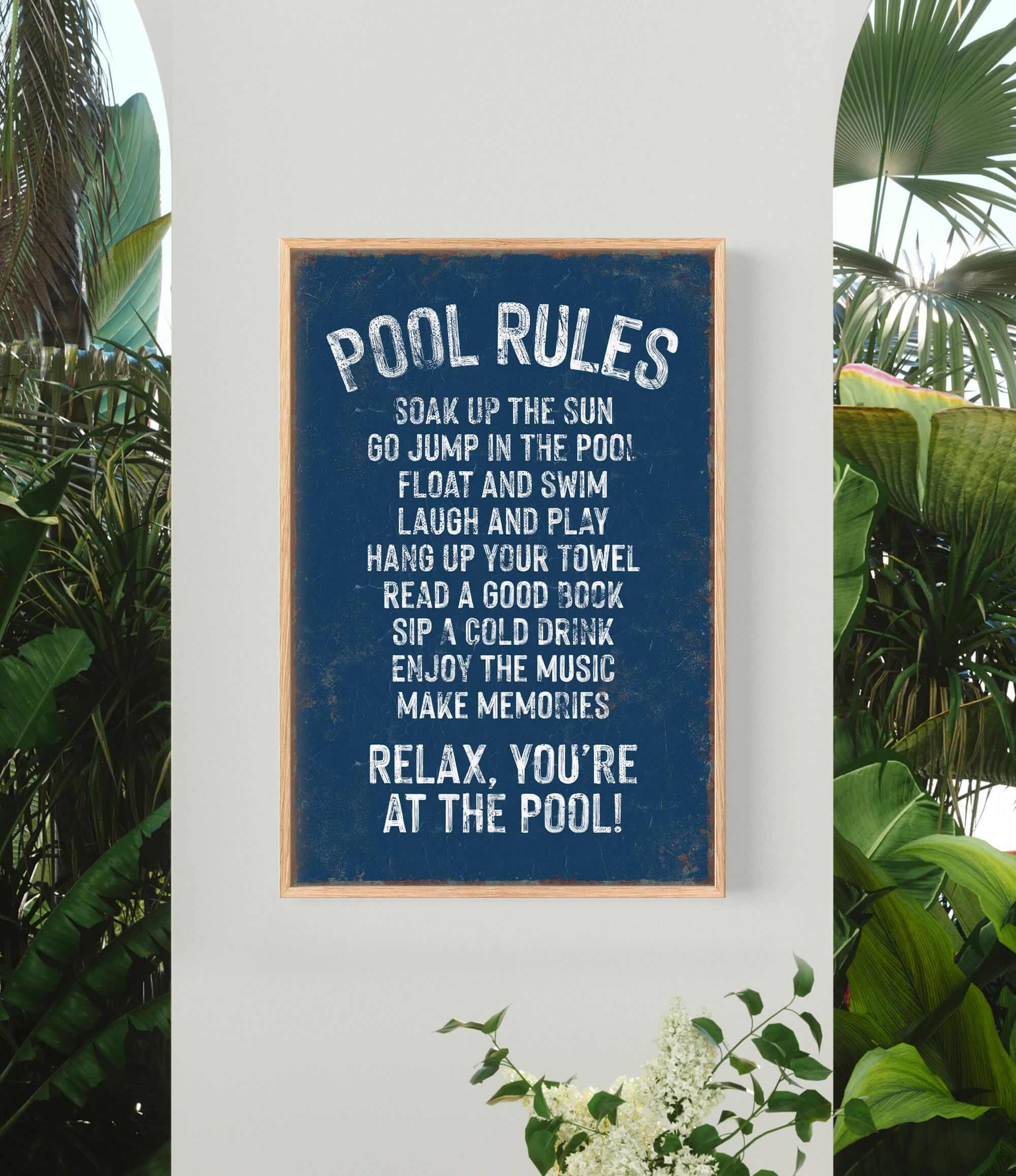 a pool rules sign hanging on the side of a wall