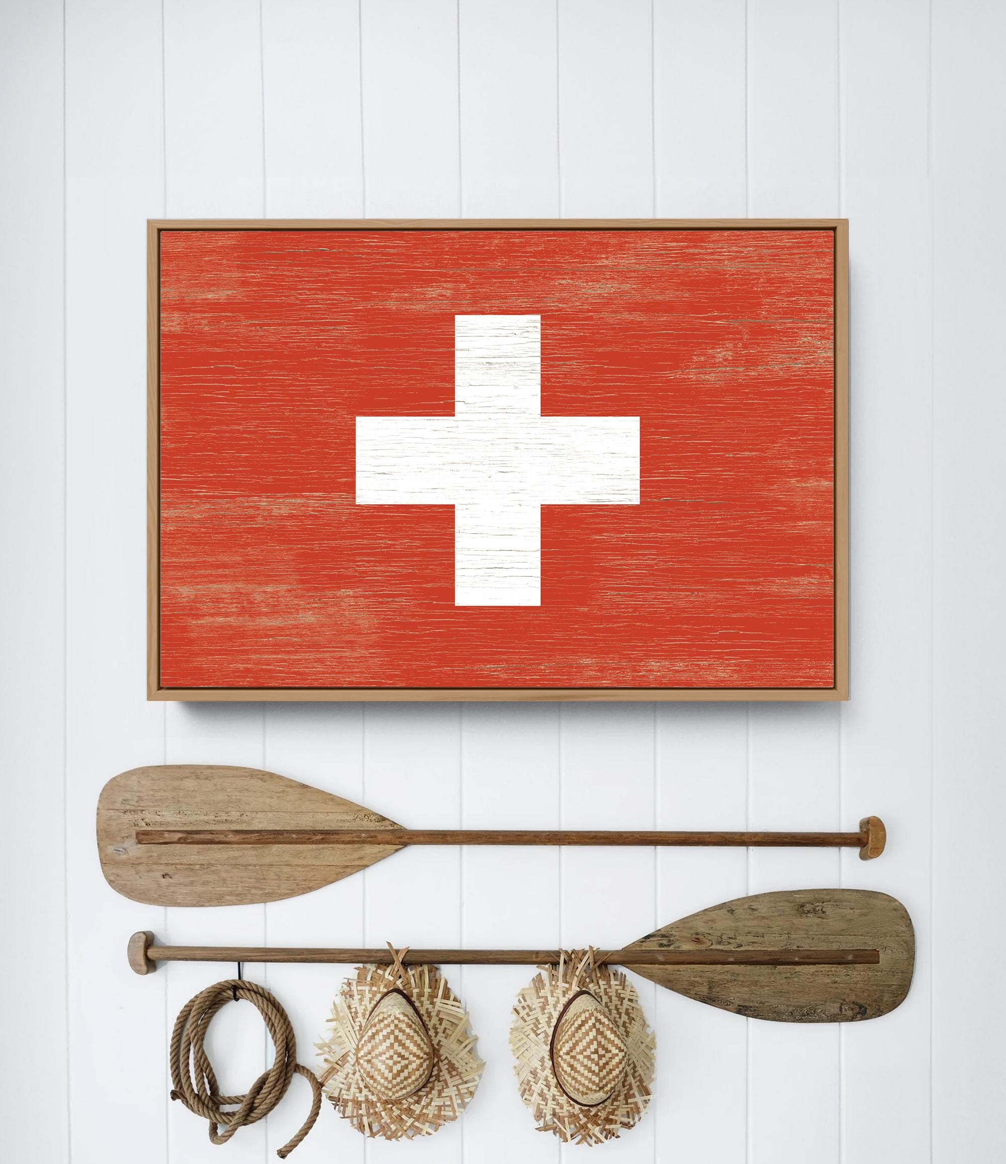 a picture of a red cross on a wall