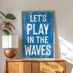 a blue sign that says let&#39;s play in the waves