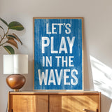 a blue sign that says let&#39;s play in the waves