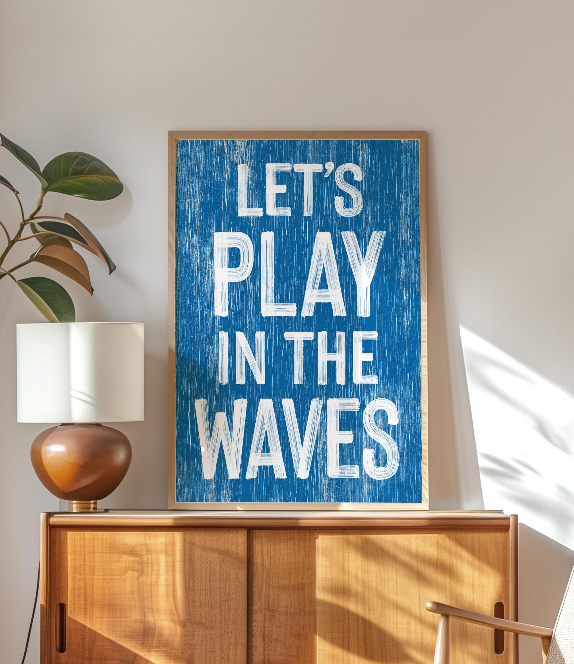 a blue sign that says let&#39;s play in the waves