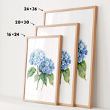 three framed watercolor paintings of blue hydrangea flowers, each with a different size and frame.