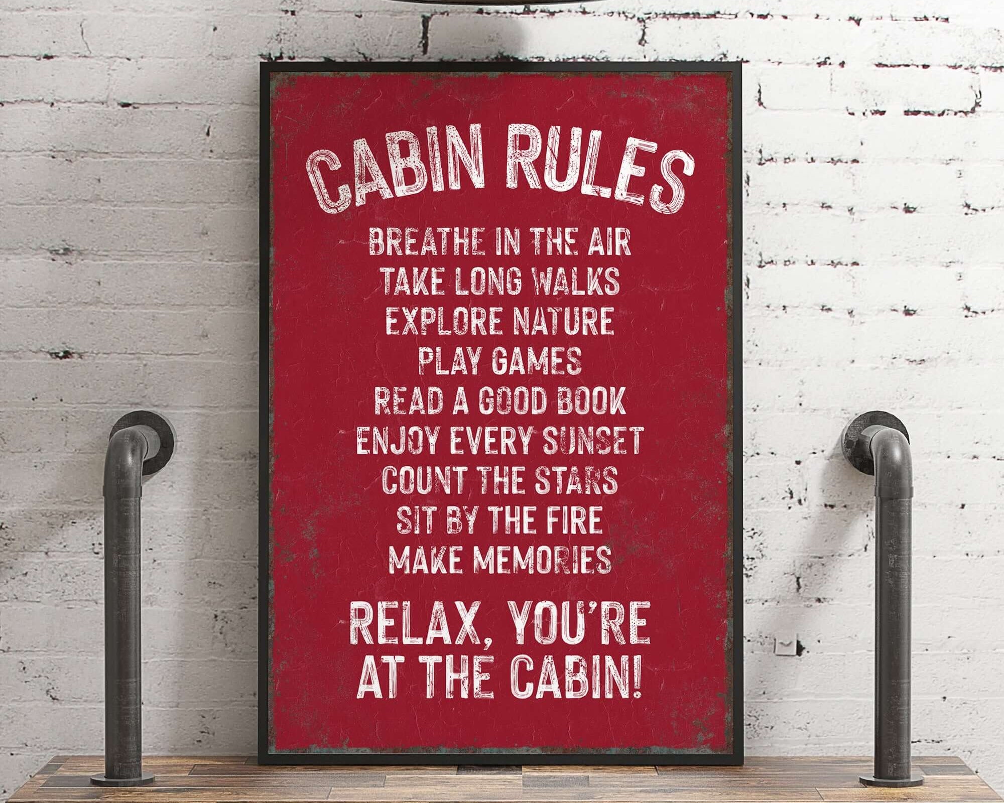 a red sign that says cabin rules on it