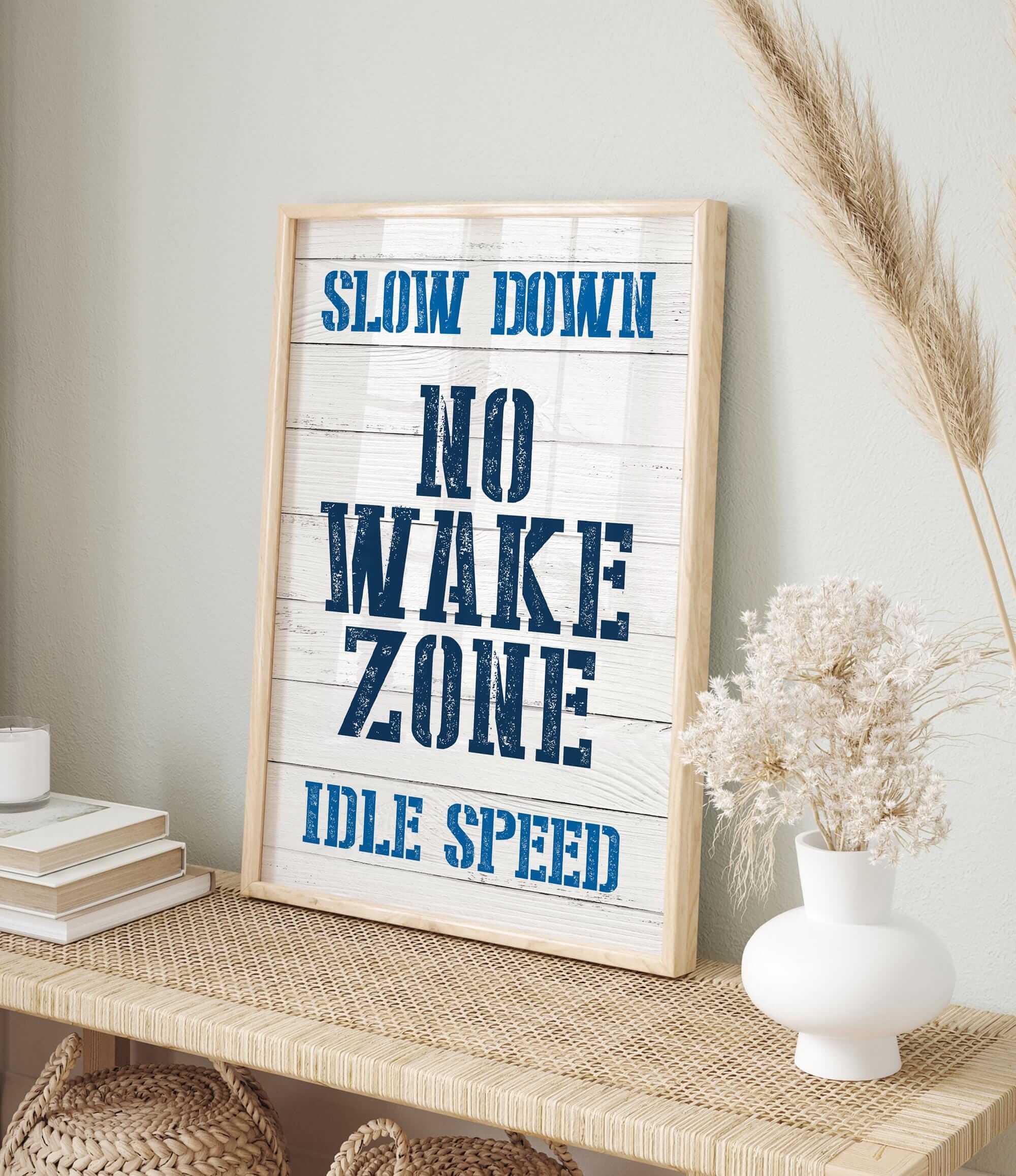 a sign that says slow down, no wake zone idle speed