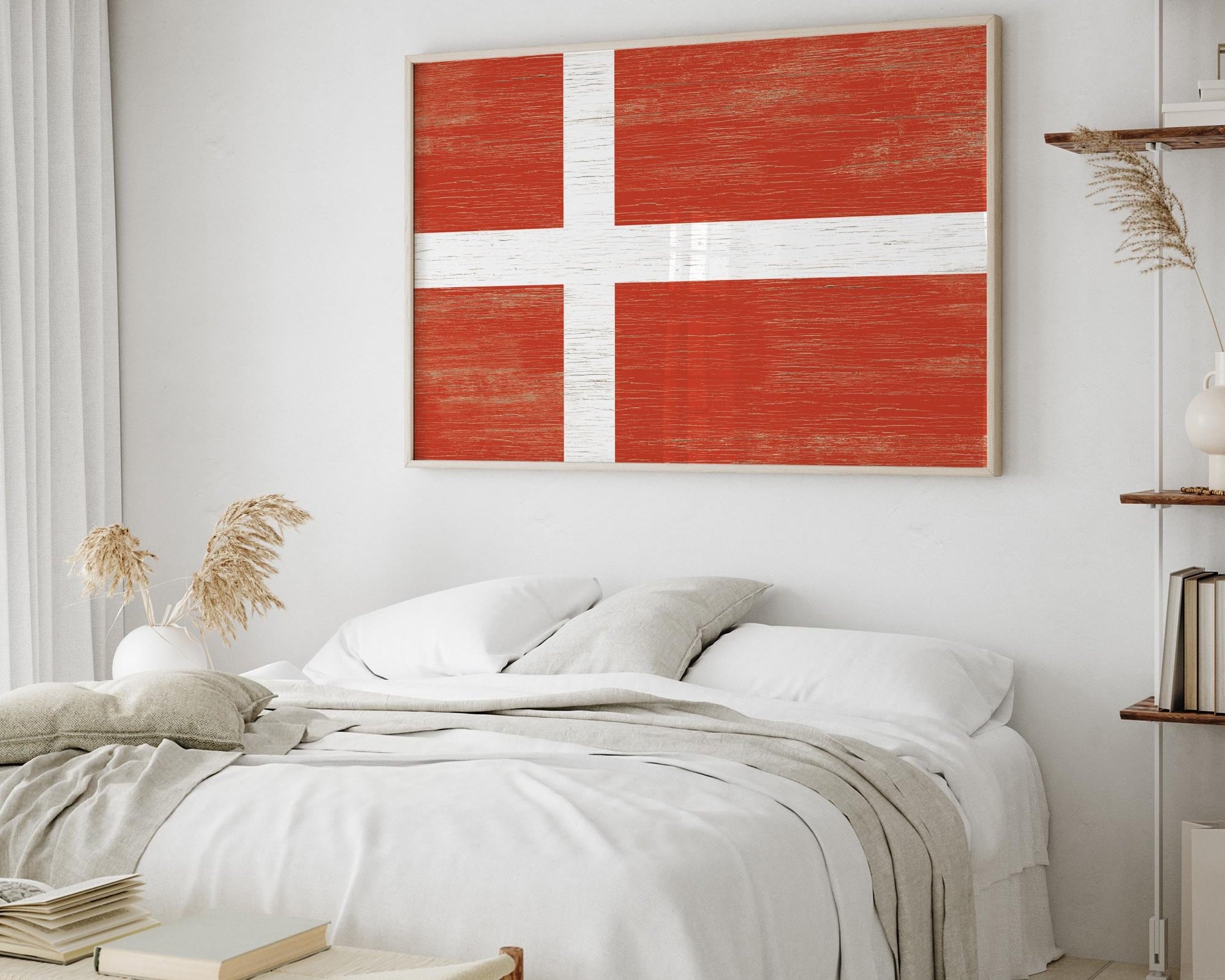 a bedroom with a bed and a painting on the wall