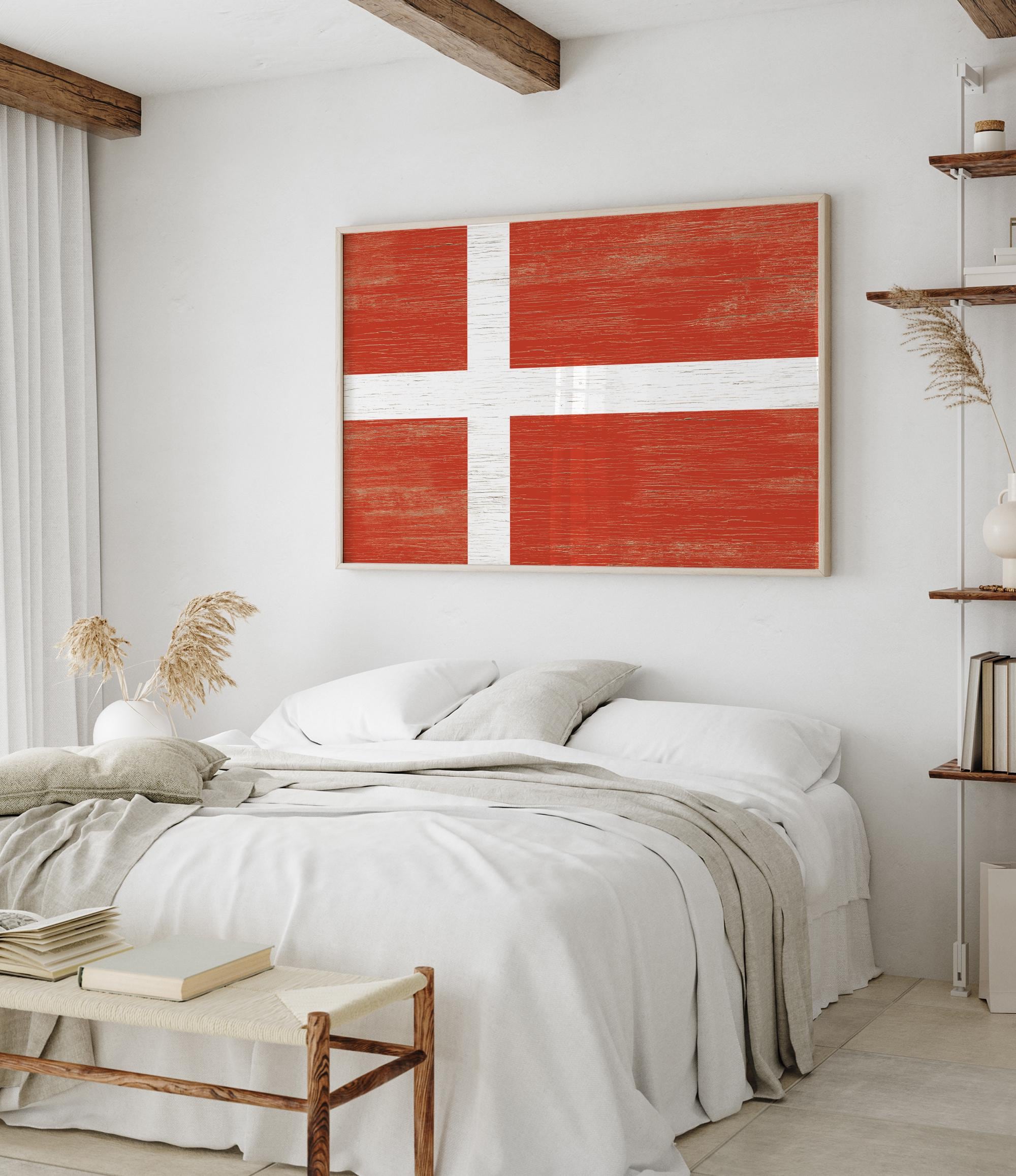 a bedroom with a bed and a painting on the wall