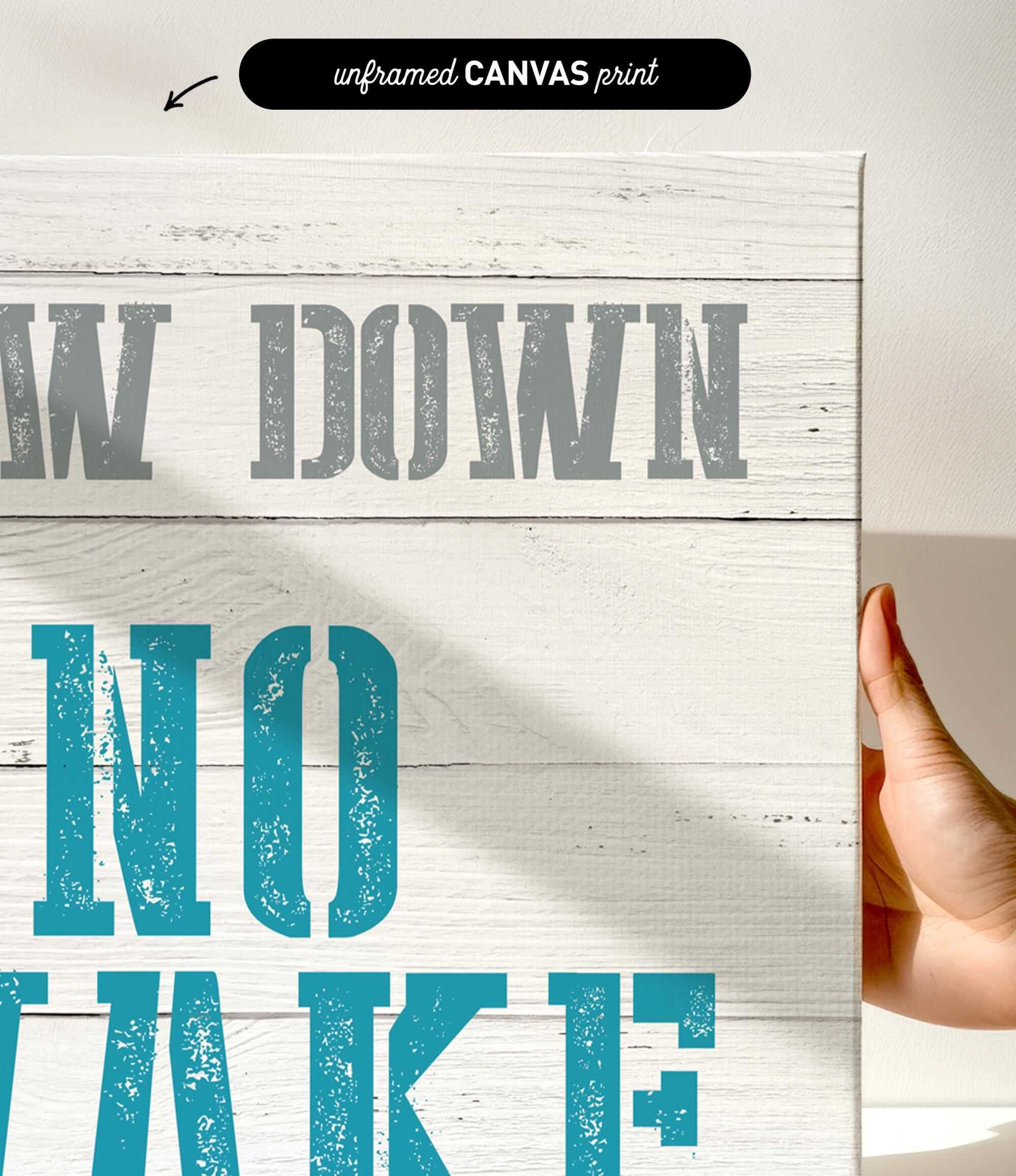 a hand holding a sign that says draw down no wake
