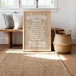 A wooden sign with white text is displayed in a room with a bench, a woven basket, and a rug.