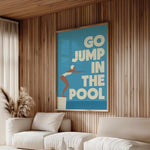 a living room with a large poster on the wall that says "GO JUMP IN THE POOL".