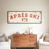 a rustic wooden dresser with a vintage-style sign above it, and two white armchairs placed in front of the dresser.