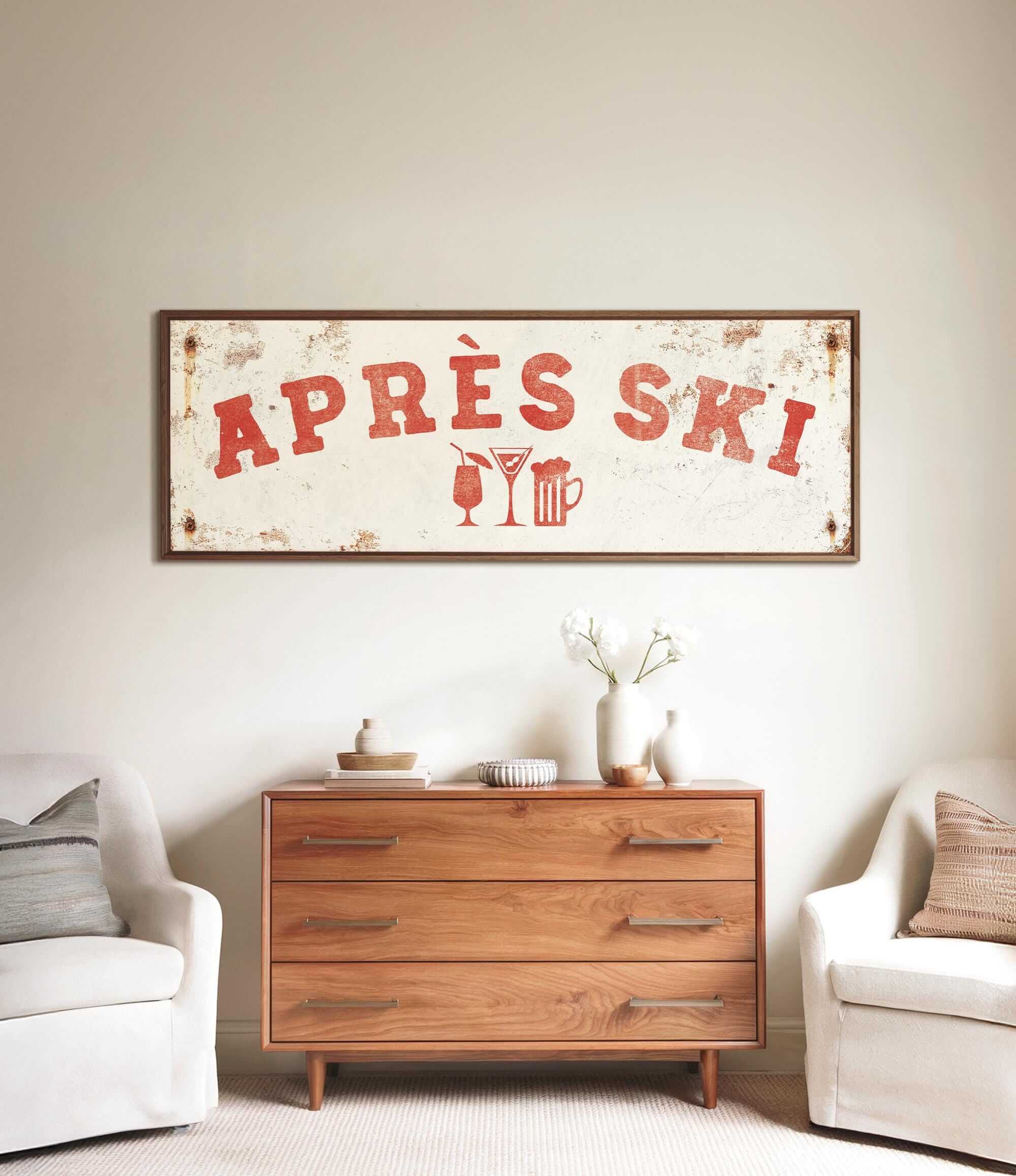 a rustic wooden dresser with a vintage-style sign above it, and two white armchairs placed in front of the dresser.