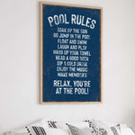 a poster hanging on the wall above a bed