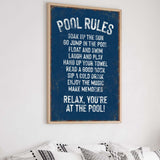 a poster hanging on the wall above a bed