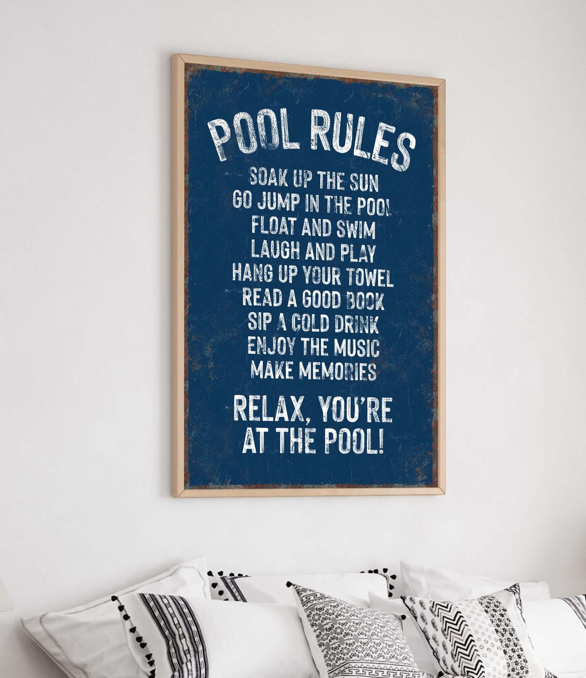 a poster hanging on the wall above a bed
