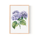 The image is a framed watercolor painting depicting a cluster of purple hydrangea flowers with green leaves.
