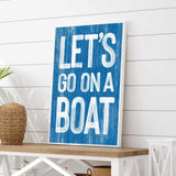 a blue sign that says let&#39;s go on a boat