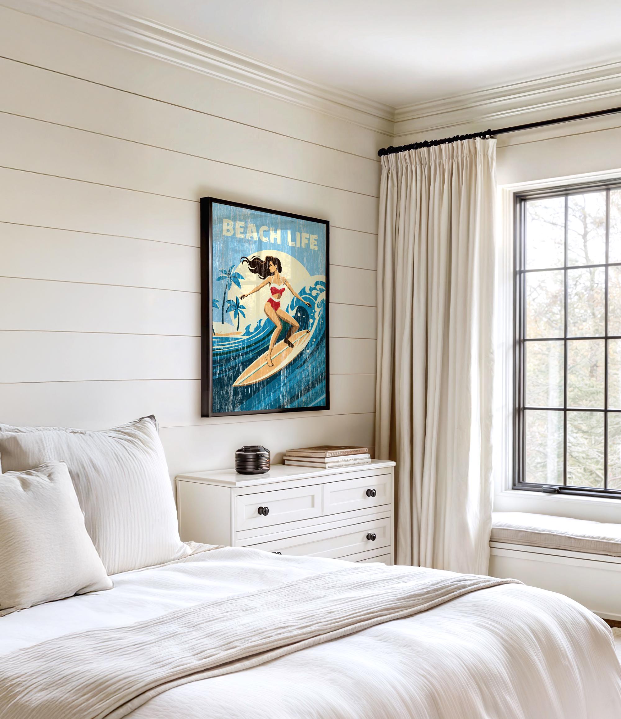 a bedroom with a large window, a white dresser, and a framed poster of a woman surfing on a blue wave.