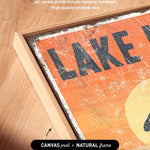 a picture of a lake sign on a wooden frame