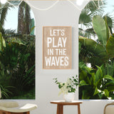 a living room with a plant and a sign on the wall