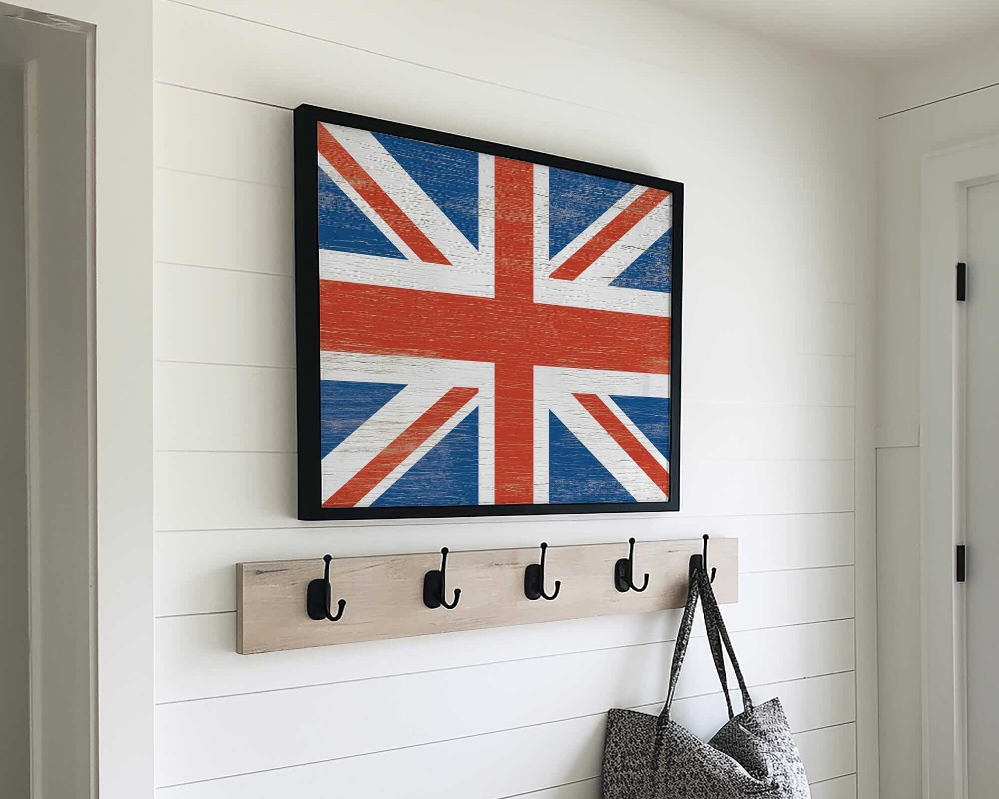 a flag hanging on a wall next to a coat rack