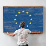 a man standing in front of a painting with stars on it