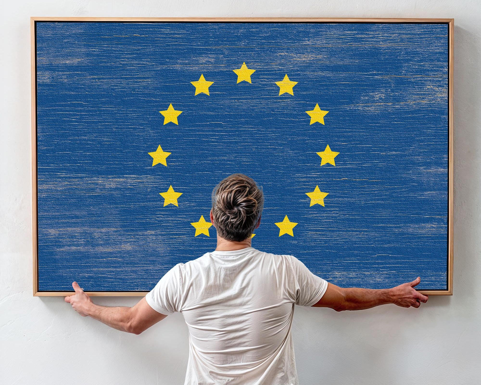 a man standing in front of a painting with stars on it