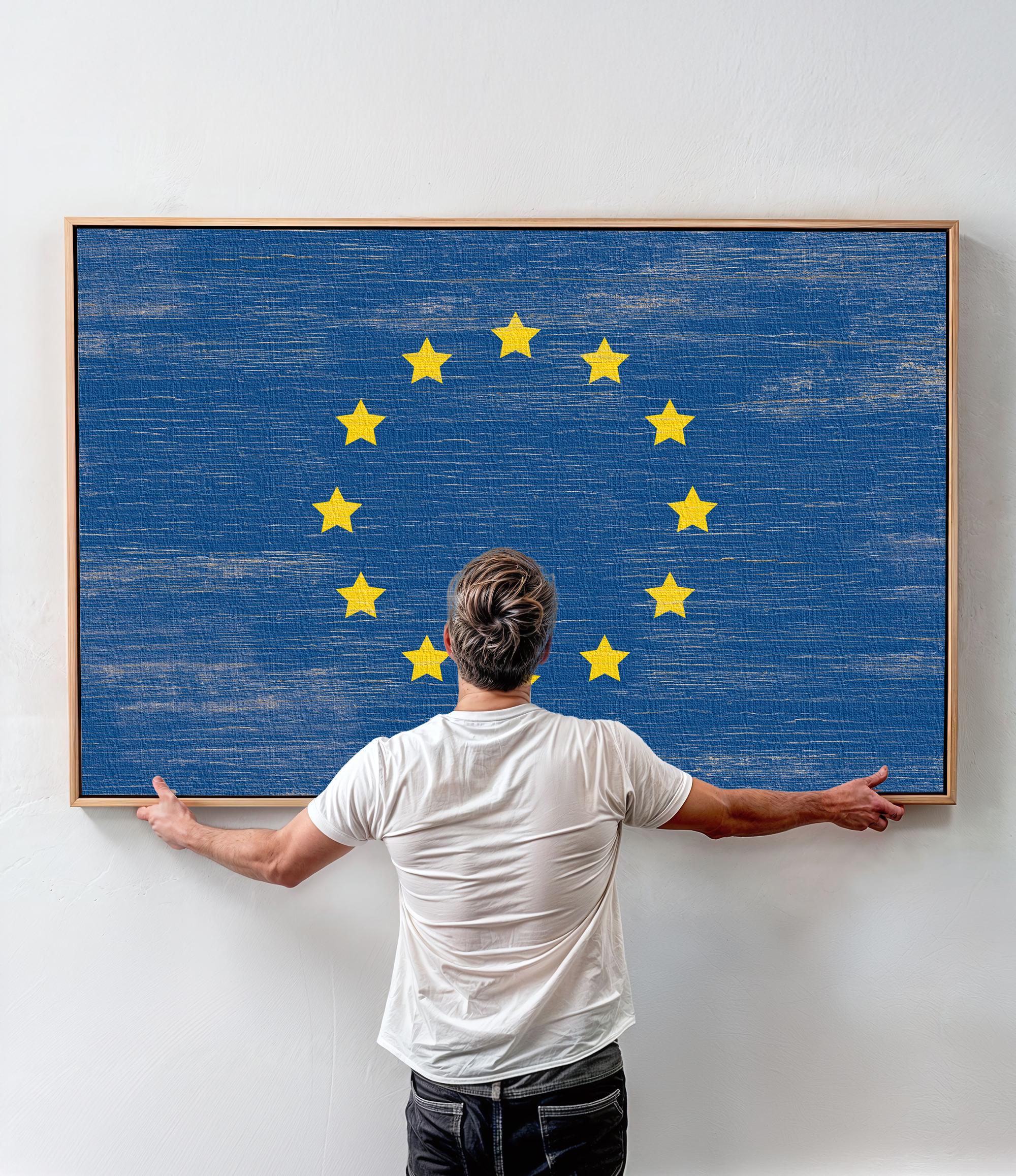 a man standing in front of a painting with stars on it