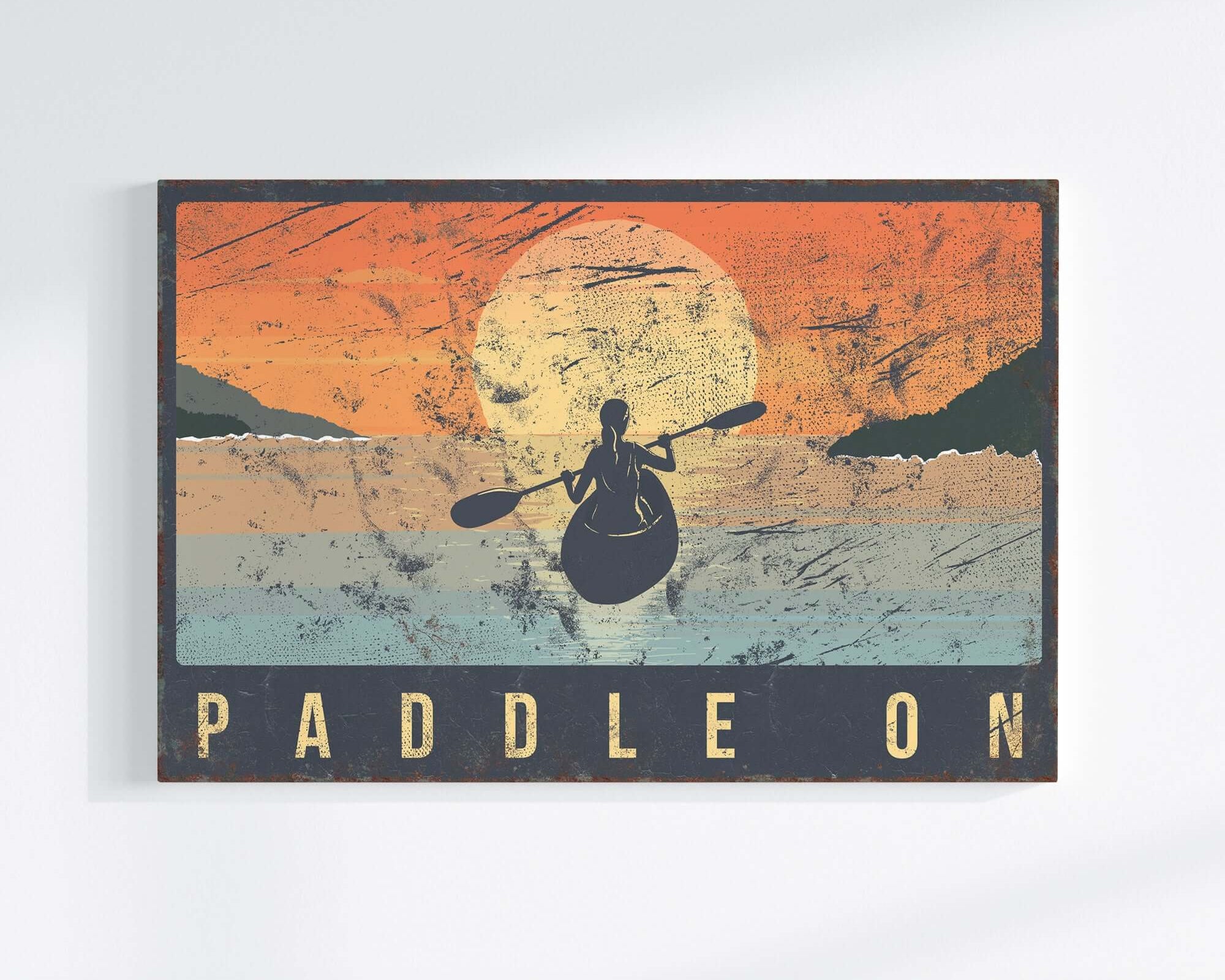 a picture of a man paddling on a canoe