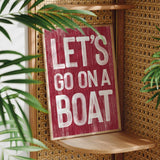 a sign that says let&#39;s go on a boat on a shelf