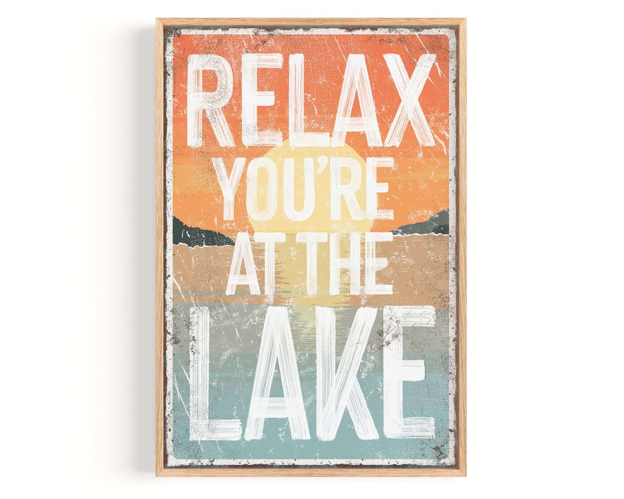 a sign that says relax you're at the lake