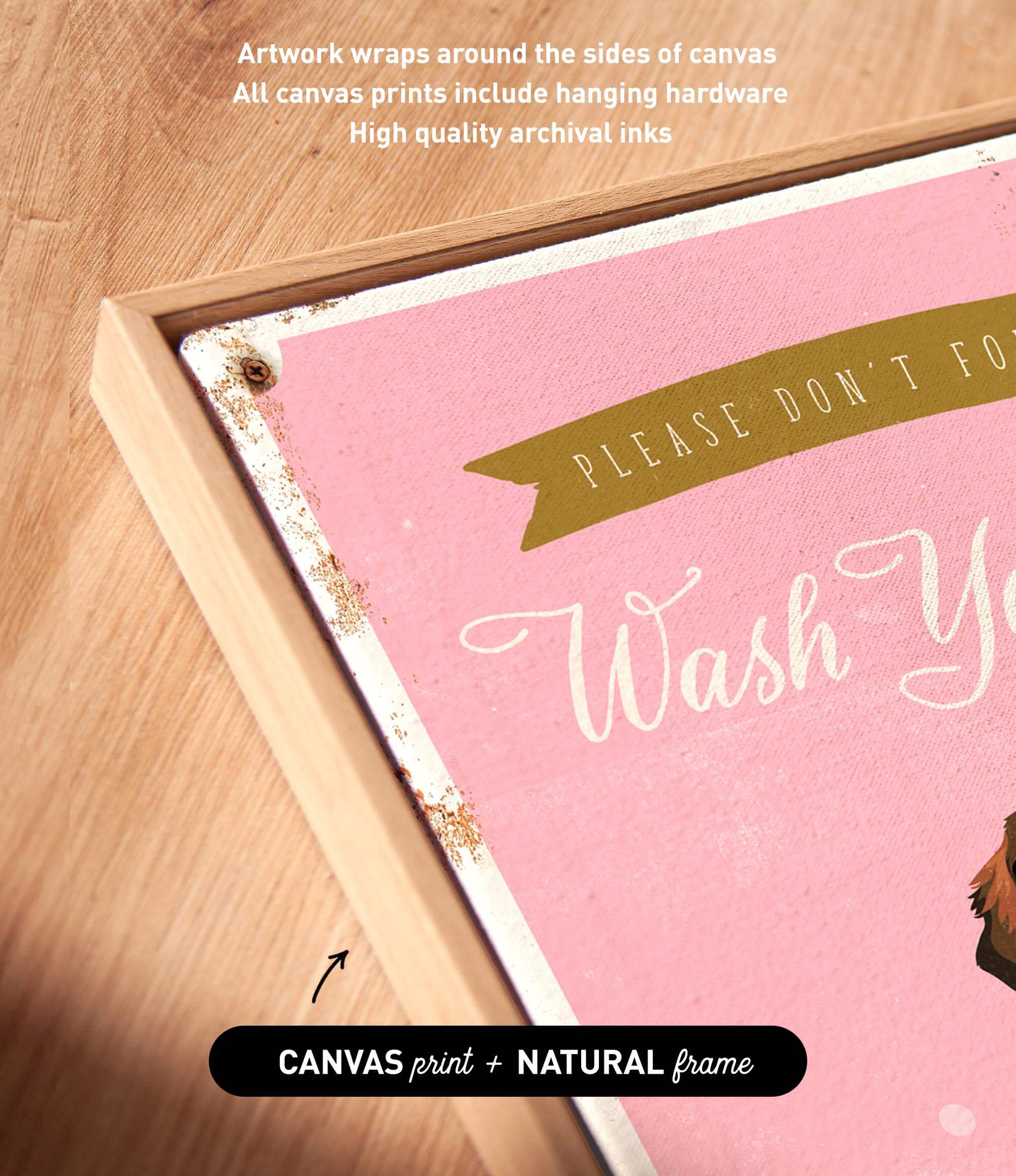 a pink canvas with the text "Please don't forget to wash your hands" written on it. The canvas is framed in a natural frame, and there is a small arrow pointing to the bottom right corner of the canvas.