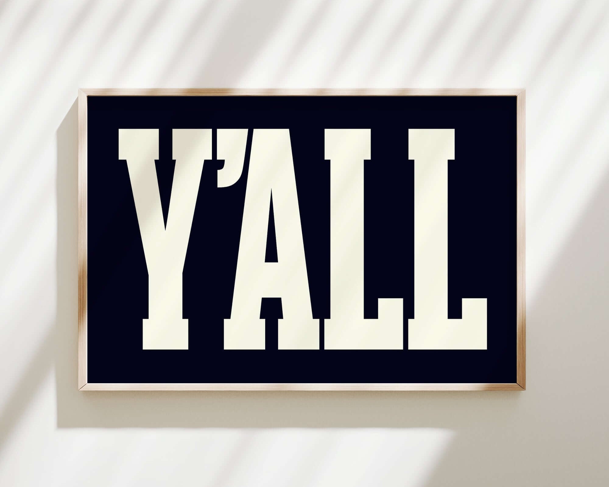 The Y'all Sign Print, Black features "Y'ALL" in bold white letters on a dark background—an ideal accent for modern farmhouse decor and a stylish addition to any wall.