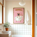 a bathroom with a pink bathtub, a towel, a plant, and a framed poster of a dog in a bathtub.