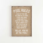 a sign that says pool rules hanging on a wall