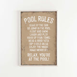 a sign that says pool rules hanging on a wall