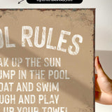 a hand holding a sign that says pool rules