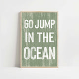 a green and white poster with the words go jump in the ocean