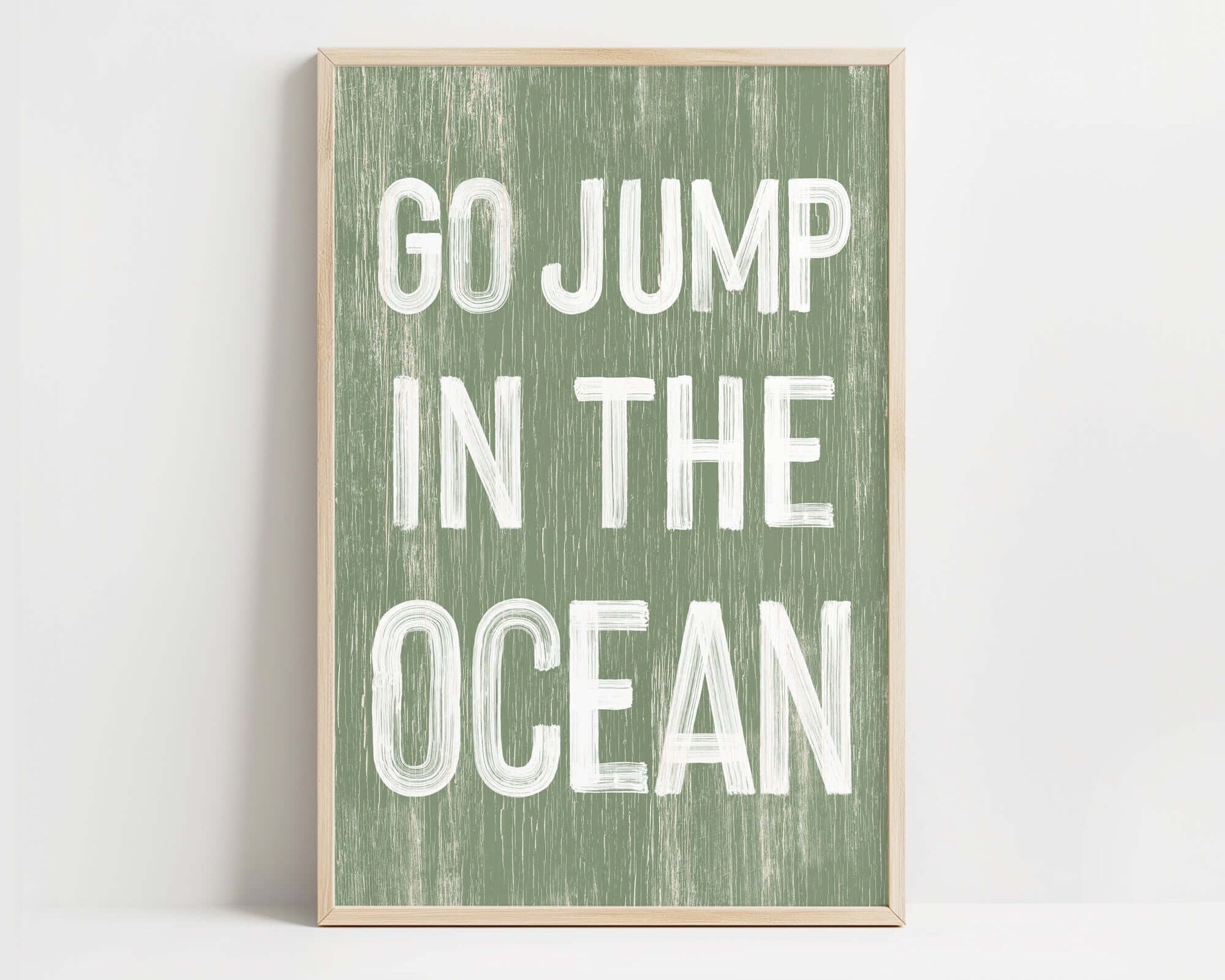 a green and white poster with the words go jump in the ocean
