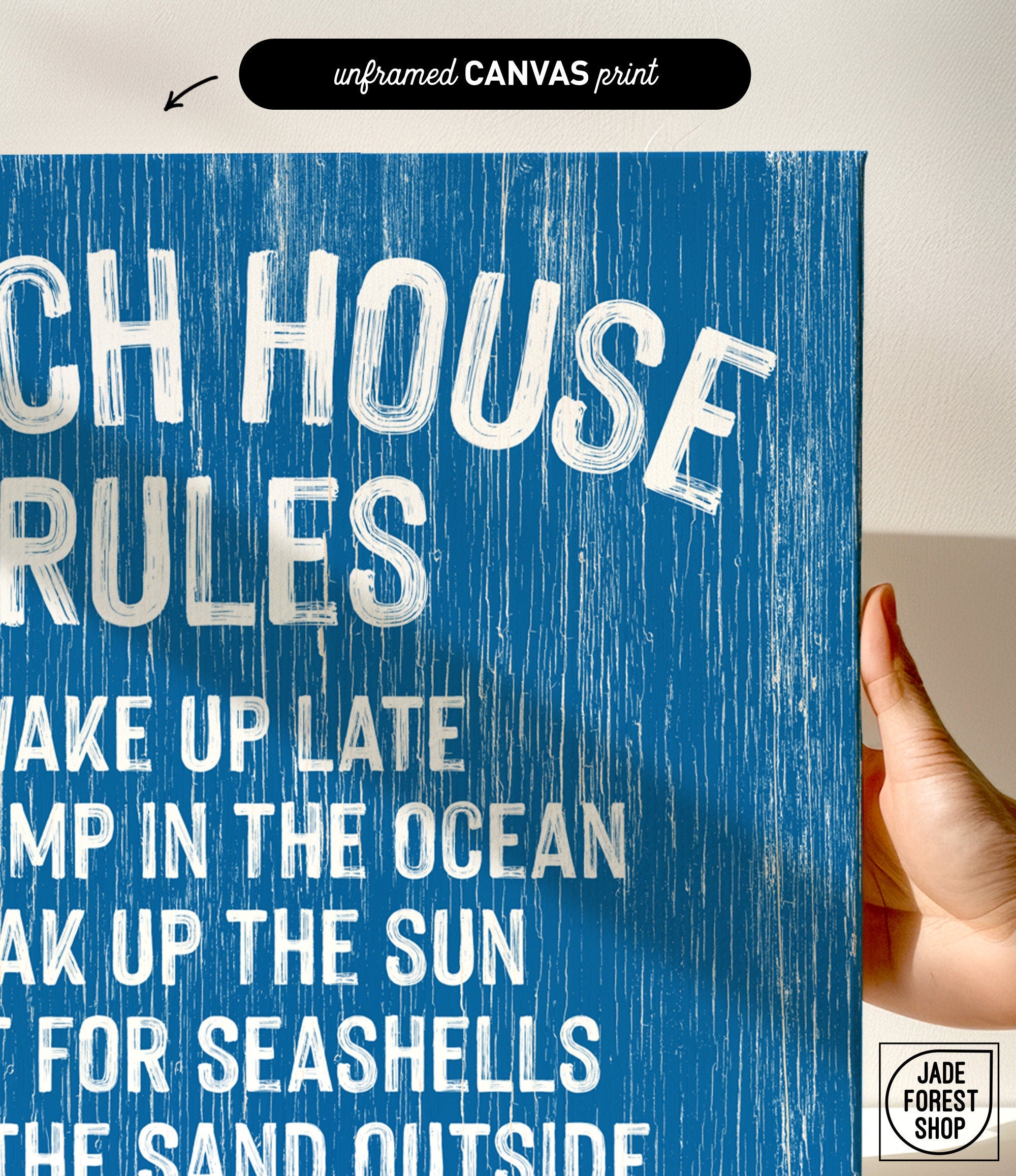 Hand holding the Beach House Rules Sign in ocean blue painted wood with white text, ideal as coastal wall art or stylish beach house décor.