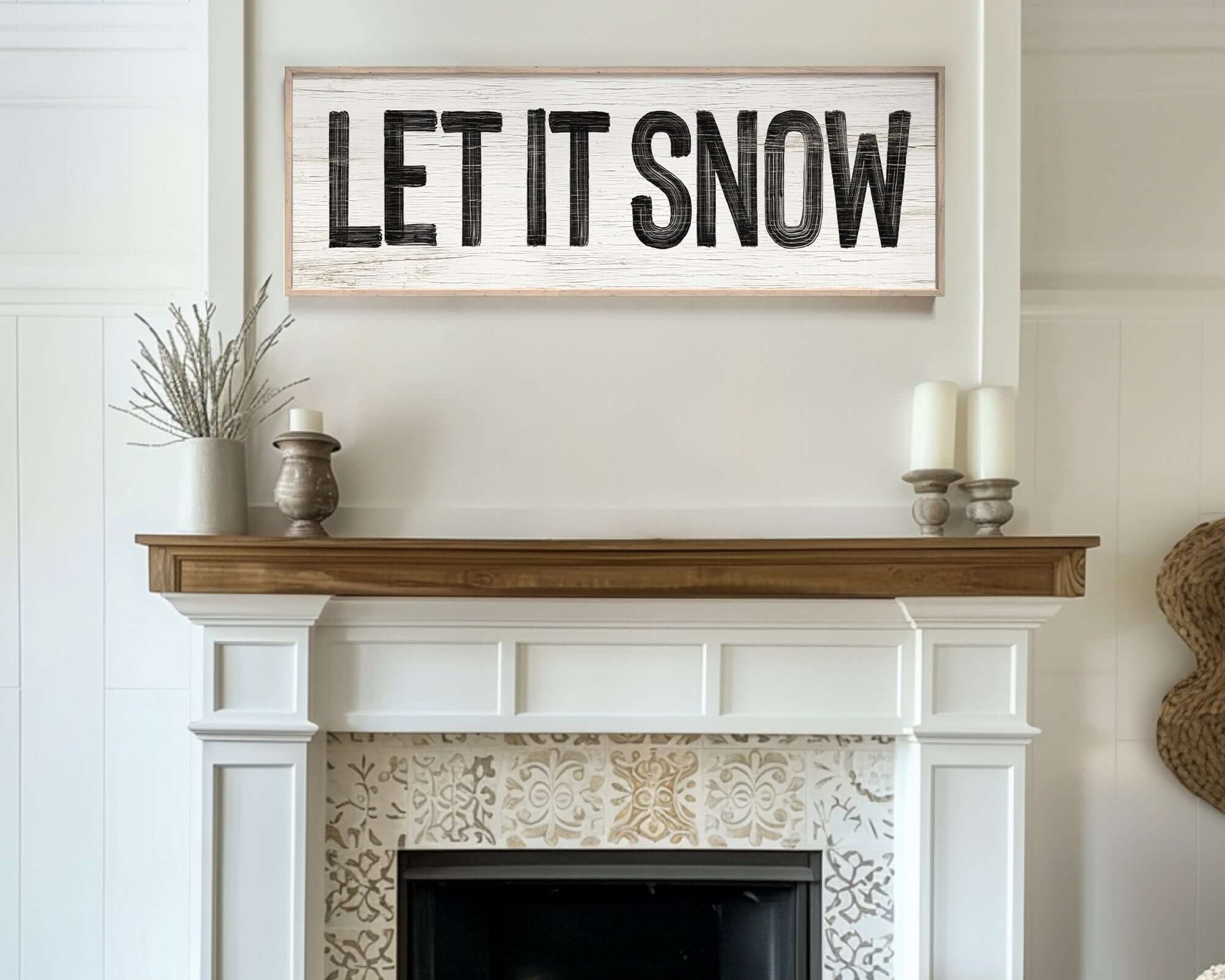a fireplace with a sign that says let it snow