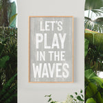 a sign that says let&#39;s play in the waves