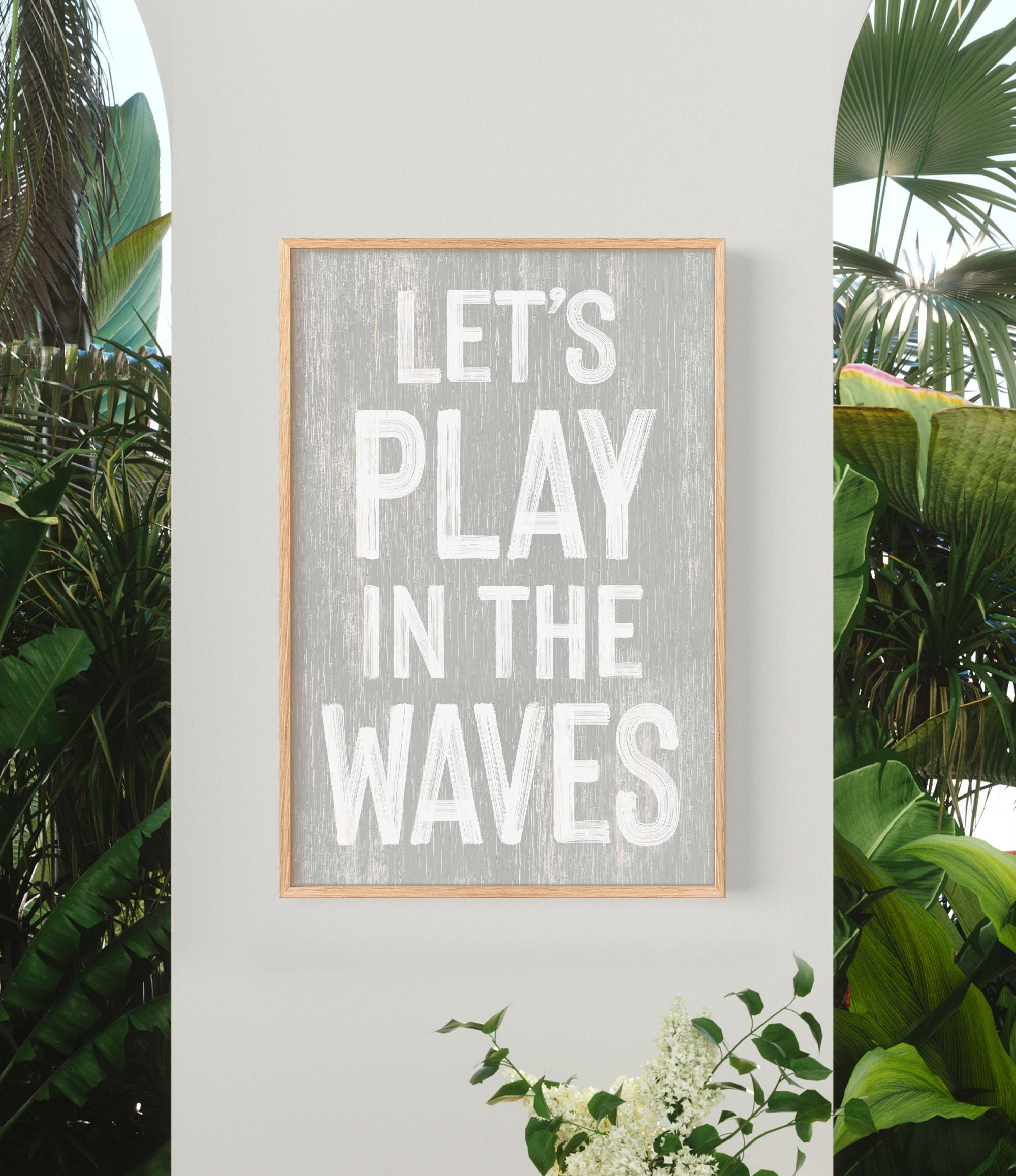 a sign that says let&#39;s play in the waves
