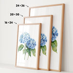 three framed watercolor paintings of blue hydrangea flowers, each with a different size and frame.