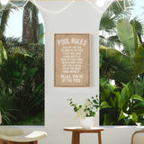 a picture of a pool rules sign hanging on a wall