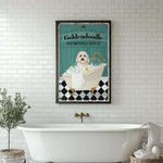 a white bath tub sitting next to a white brick wall