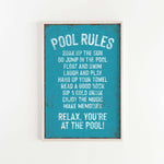 a picture of a pool rules sign hanging on a wall