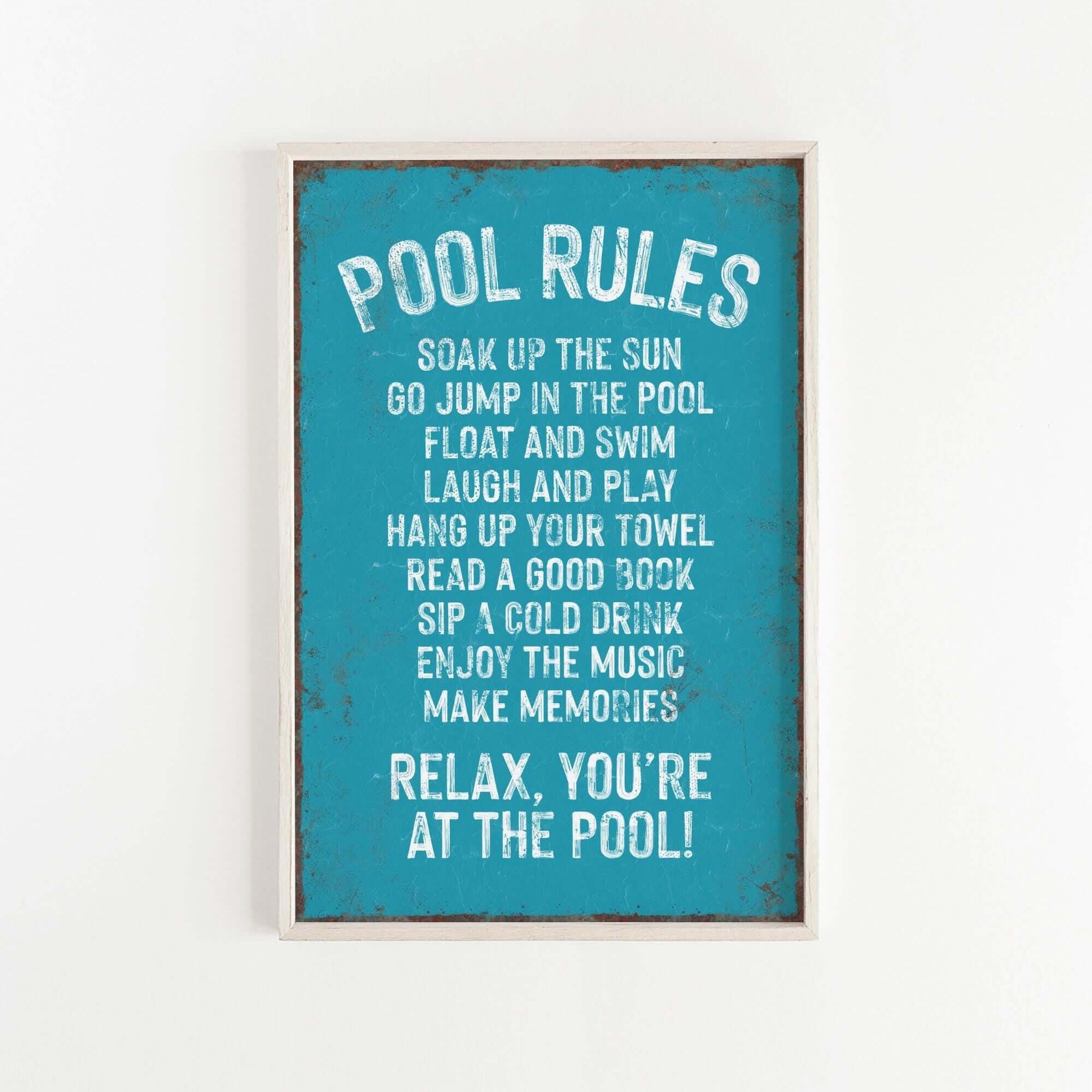 a picture of a pool rules sign hanging on a wall