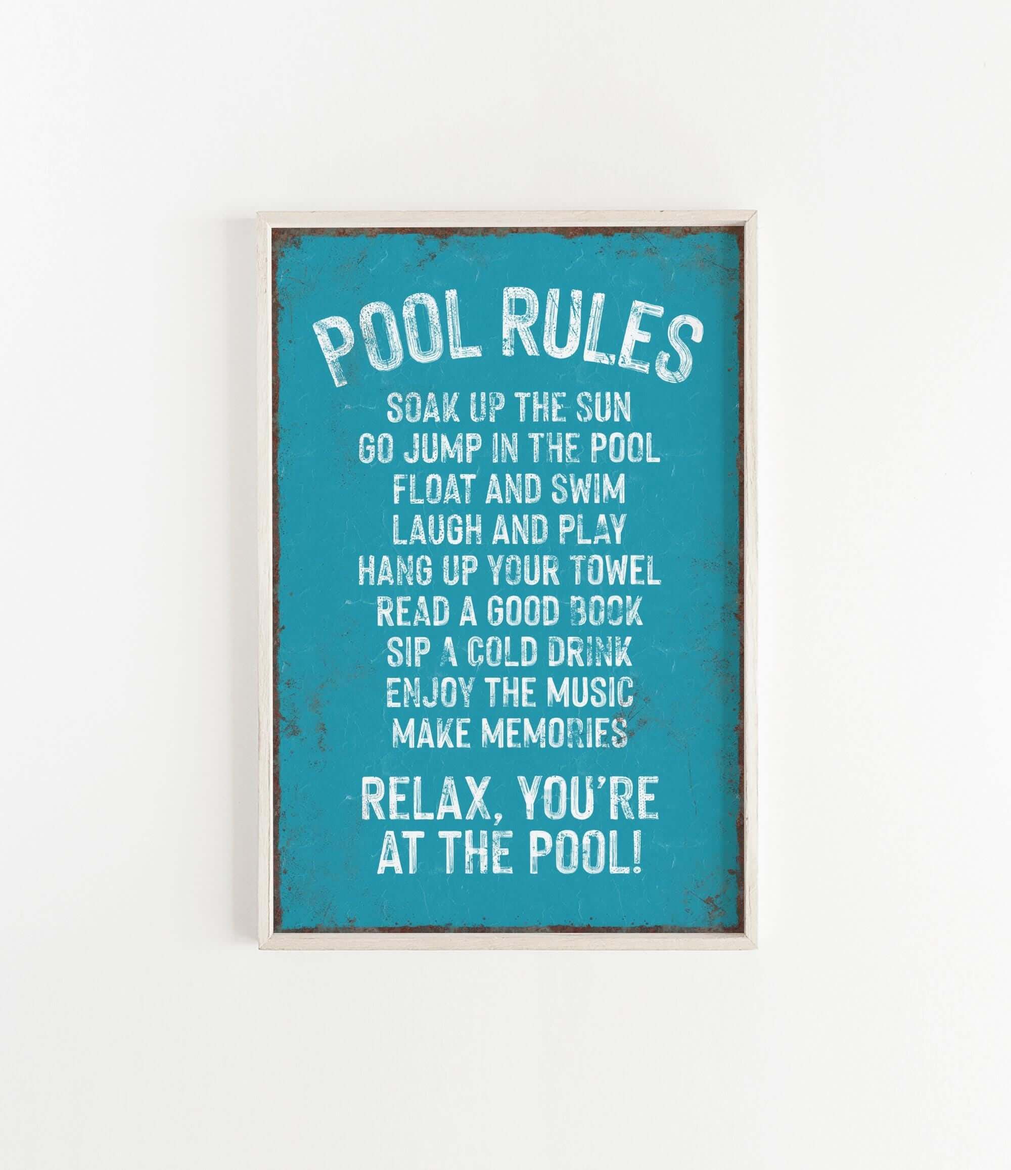 a picture of a pool rules sign hanging on a wall