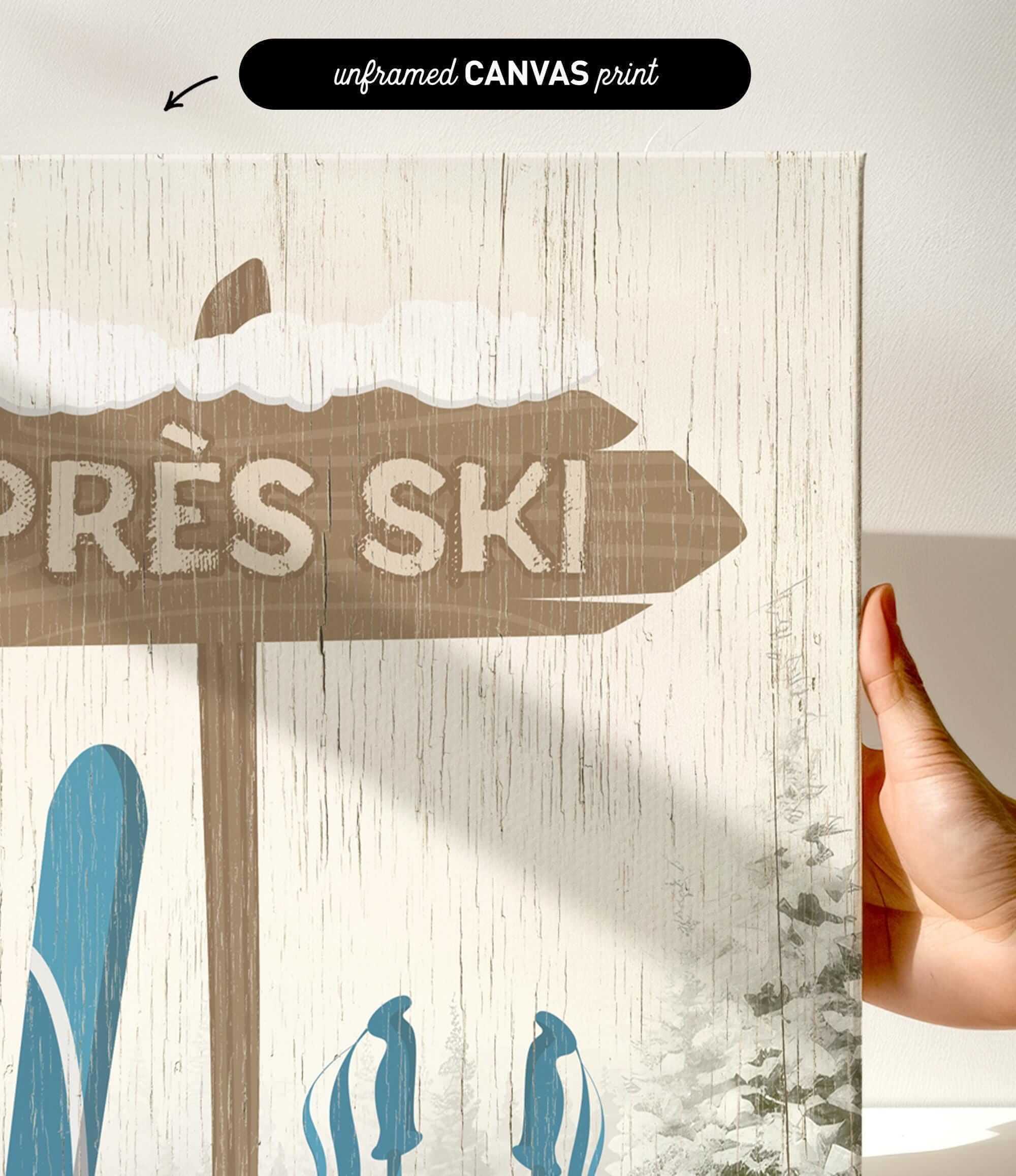 A hand holds the Cerulean Après Ski Signpost Wall Art, a rustic vintage ski sign canvas with blue ski gear—ideal mountain lodge decor for après ski artwork enthusiasts.